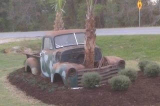 Custom landscaped bed with vintage truck centerpiece